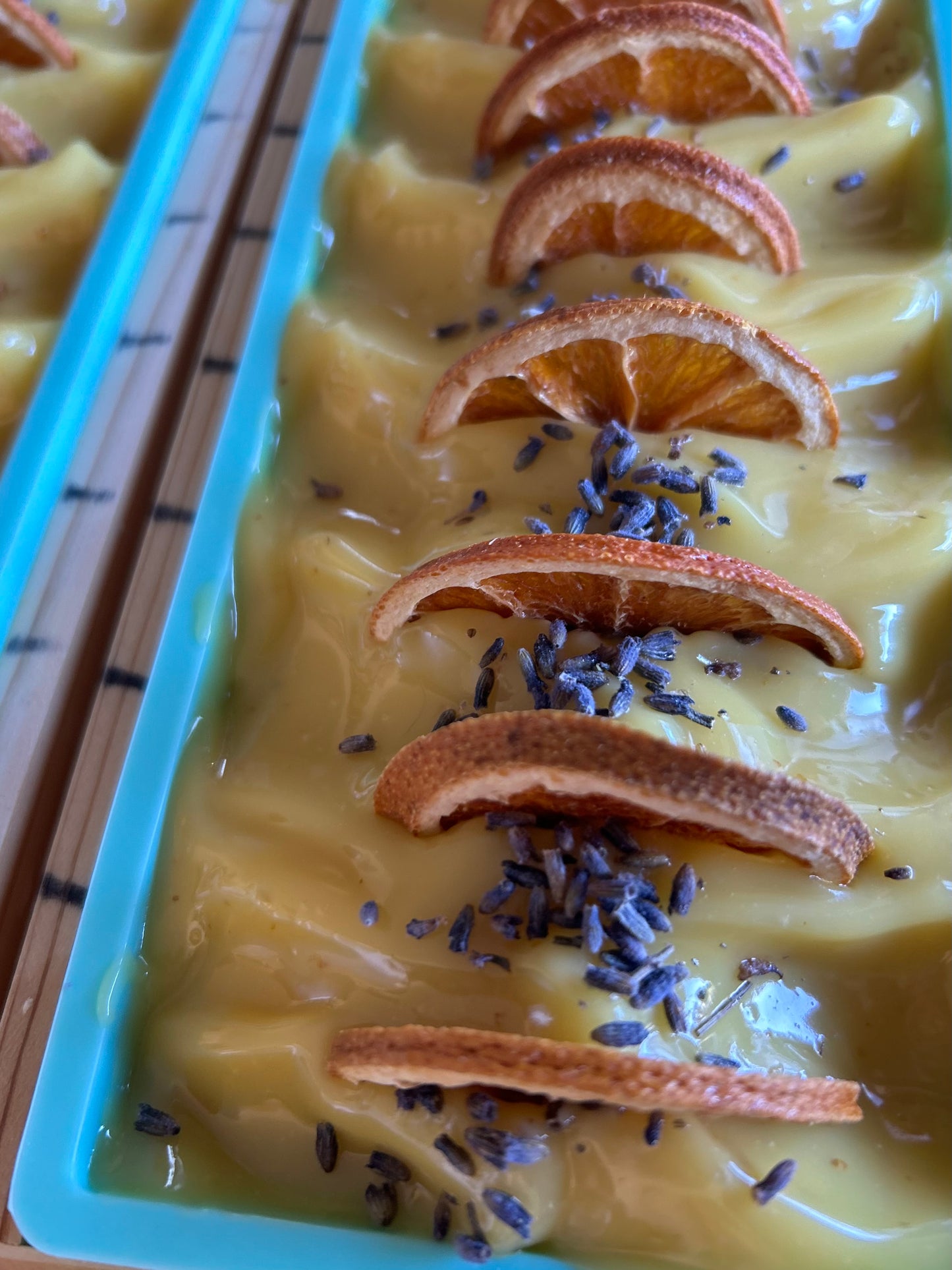 ORANGE LAVENDER goat's milk soap, kaolin clay, orange peel, orange, lavender and cedarwood essential oil, topped with orange wedge and lavender buds, Kendrick Homestead