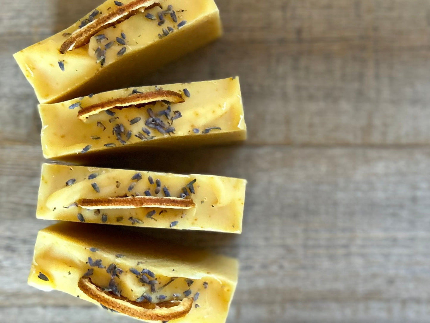 Jump start your morning routine with the invigorating smell of Orange Lavender soap. Made with nourishing goat's milk, cocoa butter, shea butter, avocado oil, kaolin clay and orange peel to lightly exfoliate, refresh and soften the skin. Kendrick Homestead