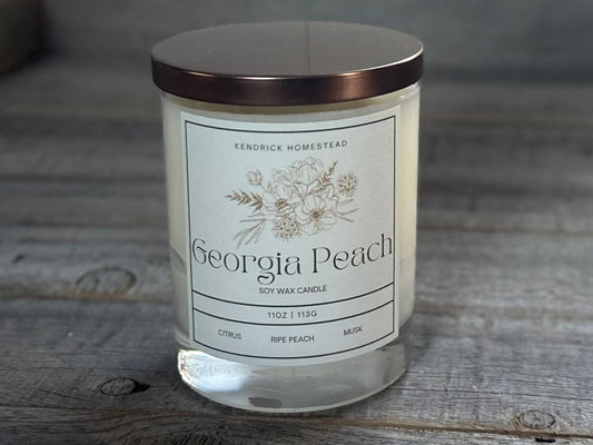 Georgia Peach Soy Wax Candle
Fresh orange sweetens the smell of freshly sliced southern peaches. Green accents elevate the fruit sensation while vanilla and musk add a velvety sugar background.
Fragrance notes:citrus, peach, green, vanilla and musk.
Kendrick Homestead