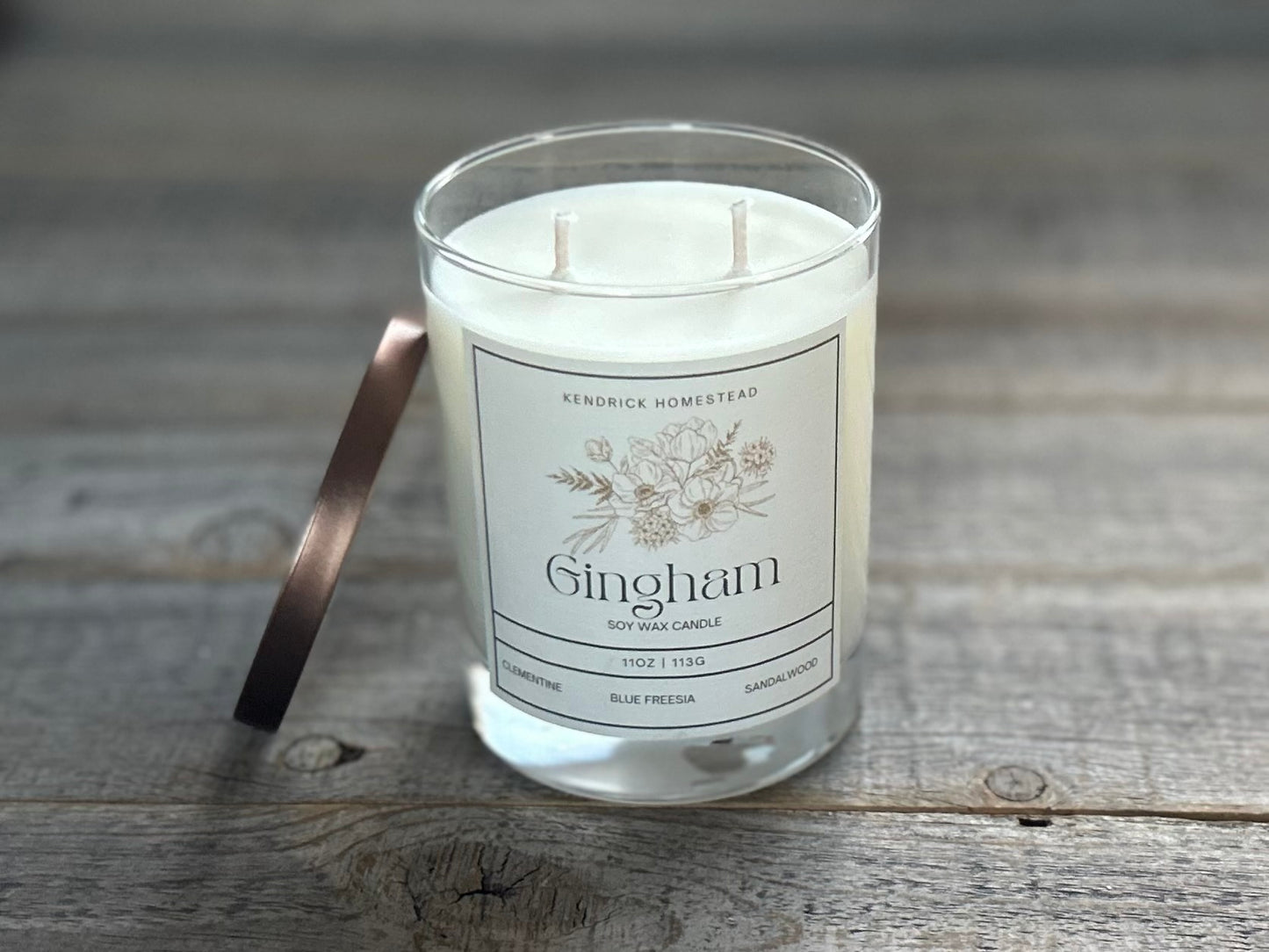 Gingham Soy Wax Candle
This refreshing fragrance captures notes of blood orange, mango and nectarine followed by wild flowers, sandalwood and musk.
Fragrance notes: Clementine, mango, nectarine, blue freesia, violet, white lily, amber, musk and sandalwood
Kendrick Homestead