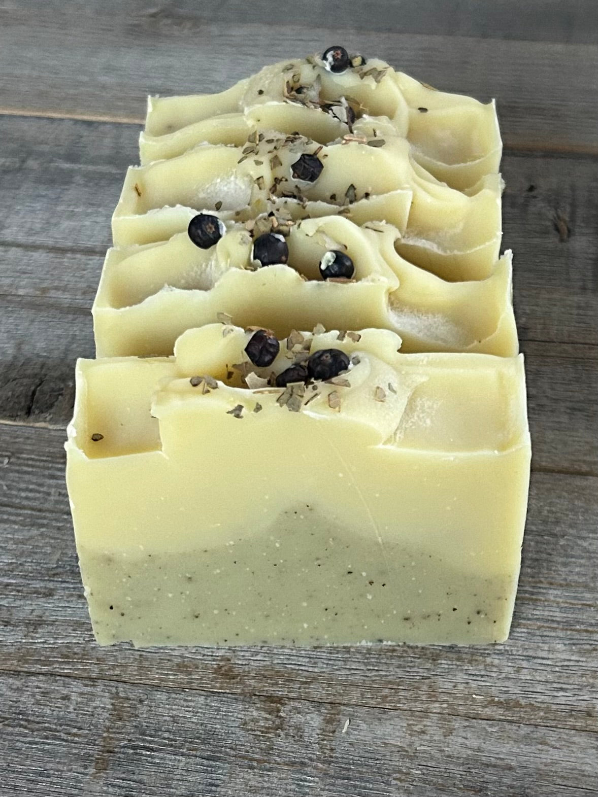 Into The Woods soap is made with a blend of peppermint, spearmint and rosemary essential oil for a refreshing, cooling effect on the skin. One of our personal all time favorite scent blends. This blend will ease your mind and clear your senses. Made with nourishing goat's milk, cocoa butter, avocado oil, kaolin clay, french green clay and ground juniper berries for light exfoliation.