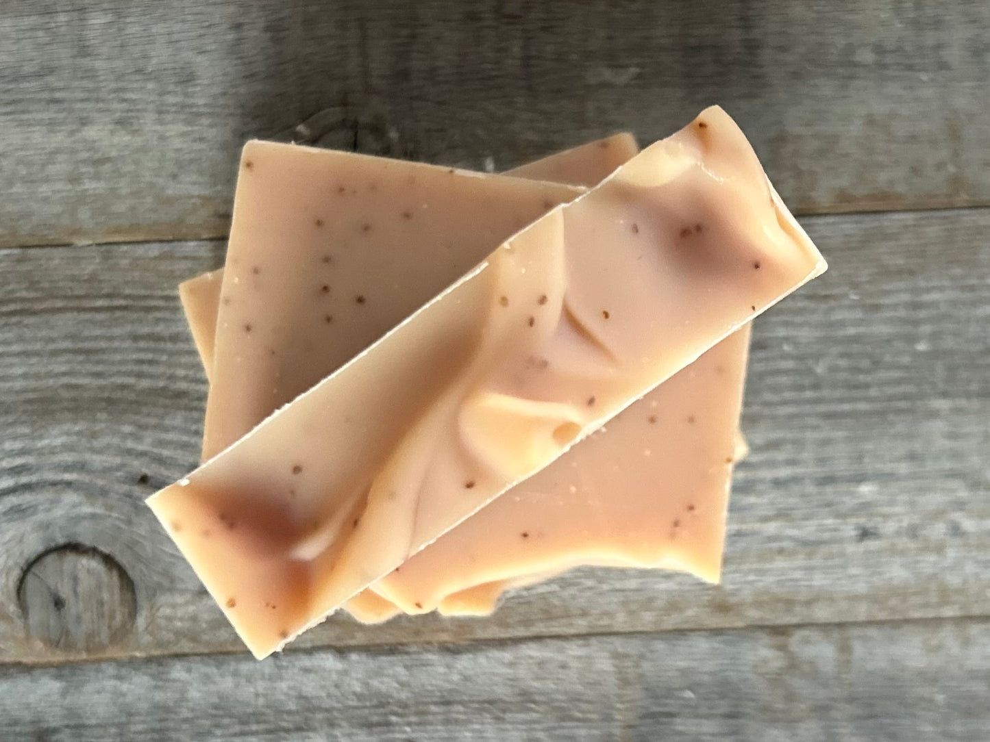 Strawberry Blossom Soap is a sweet citrus blend of neroli and bergamot essential oils. This soap is made with soothing coconut milk, olive oil, coconut oil, cocoa butter, avocado oil and castor oil. Naturally colored with pink clay and strawberry seeds for exfoliation.
