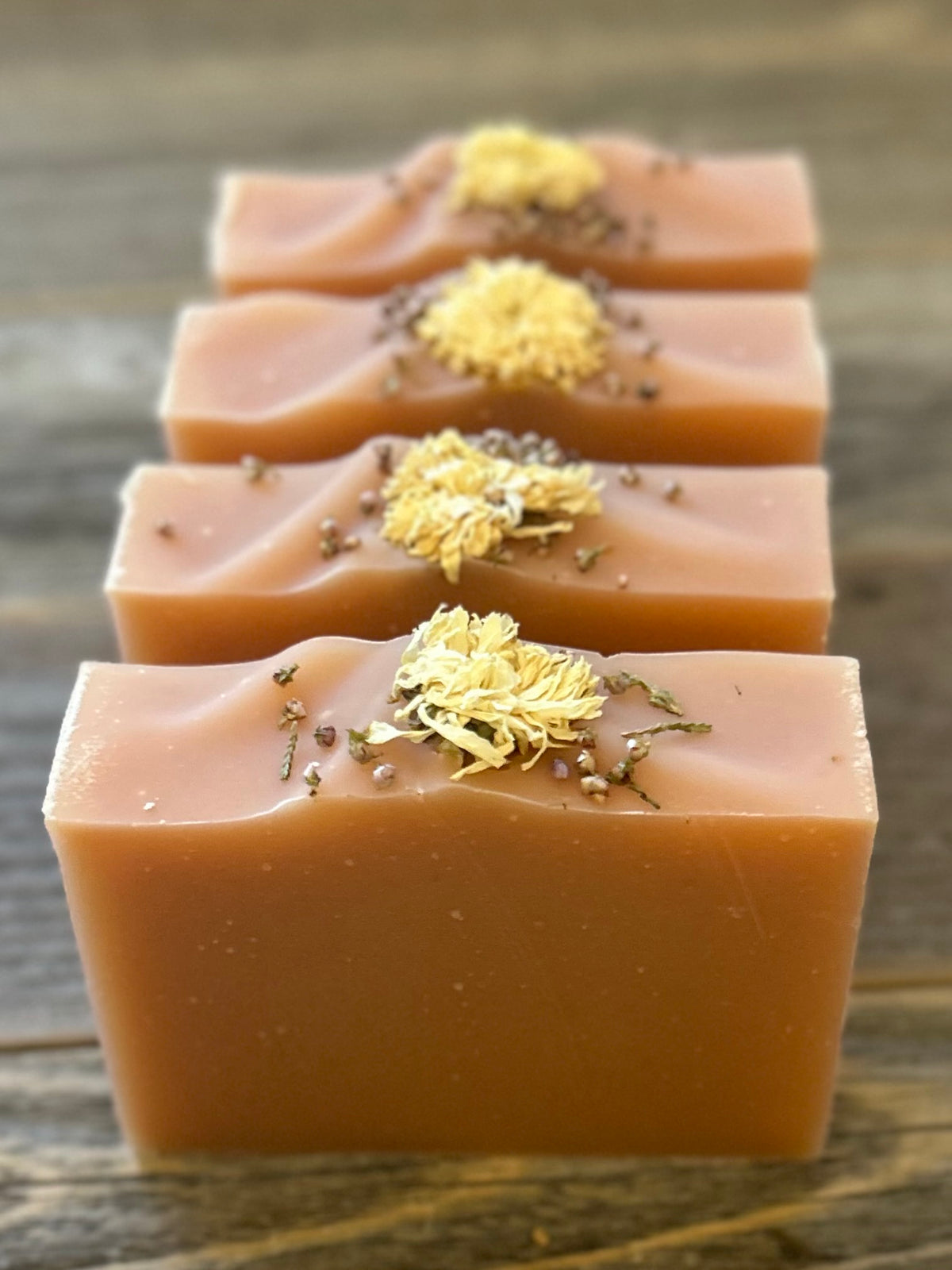 Citrus Blossom Soap is a delicious citrus blend of grapefruit, lemongrass and lime. Made with soothing goat's milk, cocoa butter, creamy shea butter and avocado oil. Naturally colored with rose clay and topped with a variety of dried flowers. Kendrick Homestead