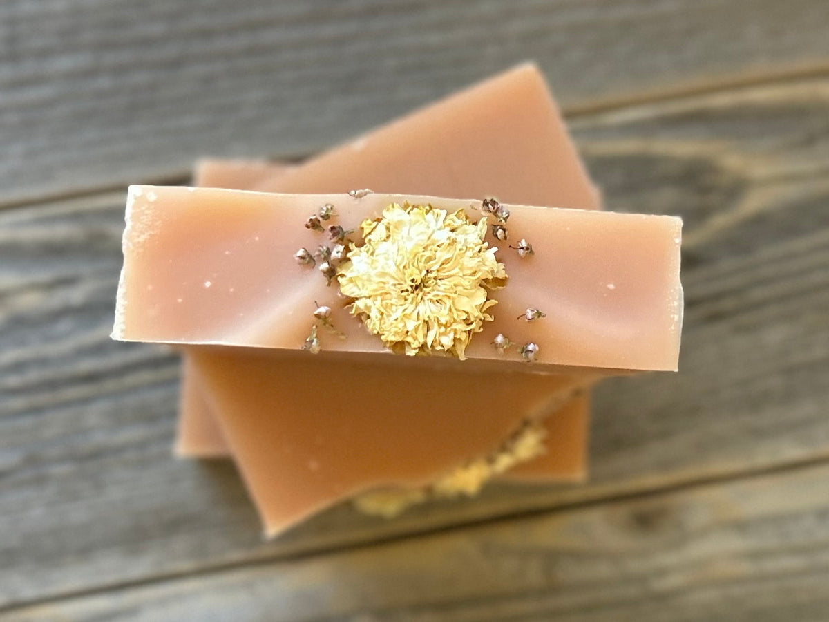Citrus Blossom Soap is a delicious citrus blend of grapefruit, lemongrass and lime. Made with soothing goat's milk, cocoa butter, creamy shea butter and avocado oil. Naturally colored with rose clay and topped with a variety of dried flowers. Kendrick Homestead