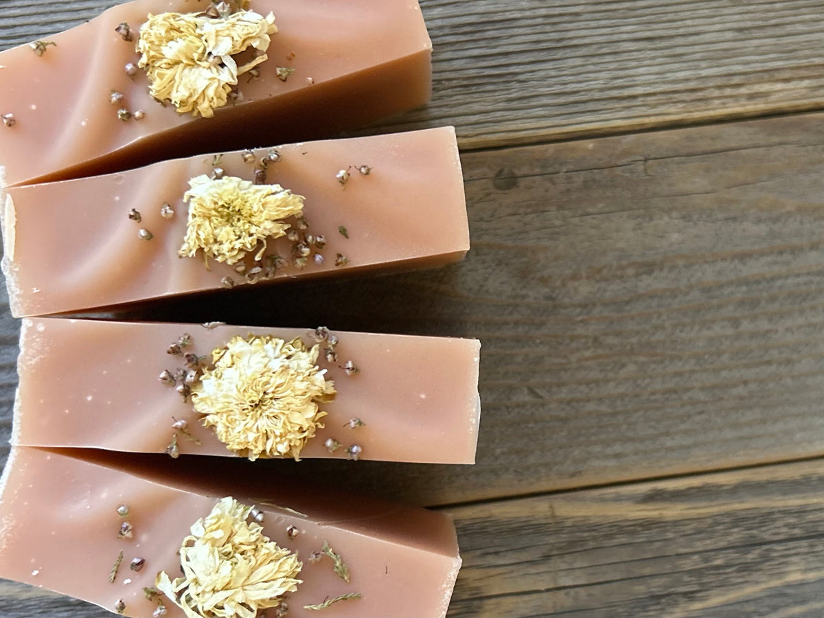 Citrus Blossom Soap is a delicious citrus blend of grapefruit, lemongrass and lime. Made with soothing goat's milk, cocoa butter, creamy shea butter and avocado oil. Naturally colored with rose clay and topped with a variety of dried flowers. Kendrick Homestead