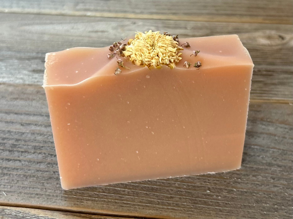 Citrus Blossom Soap is a delicious citrus blend of grapefruit, lemongrass and lime. Made with soothing goat's milk, cocoa butter, creamy shea butter and avocado oil. Naturally colored with rose clay and topped with a variety of dried flowers. Kendrick Homestead