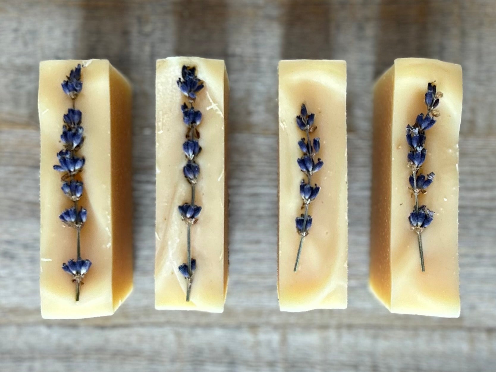 Lemon Lavender Goat's Milk soap, lemon , litsea cubeba and lavender essential oil, topped with a lavender sprig, kaolin clay, Kendrick Homestead