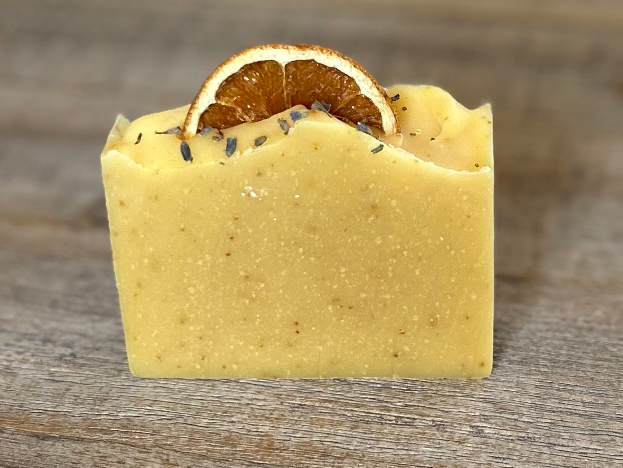 Jump start your morning routine with the invigorating smell of Orange Lavender soap. Made with nourishing goat's milk, cocoa butter, shea butter, avocado oil, kaolin clay and orange peel to lightly exfoliate, refresh and soften the skin.  Kendrick Homestead