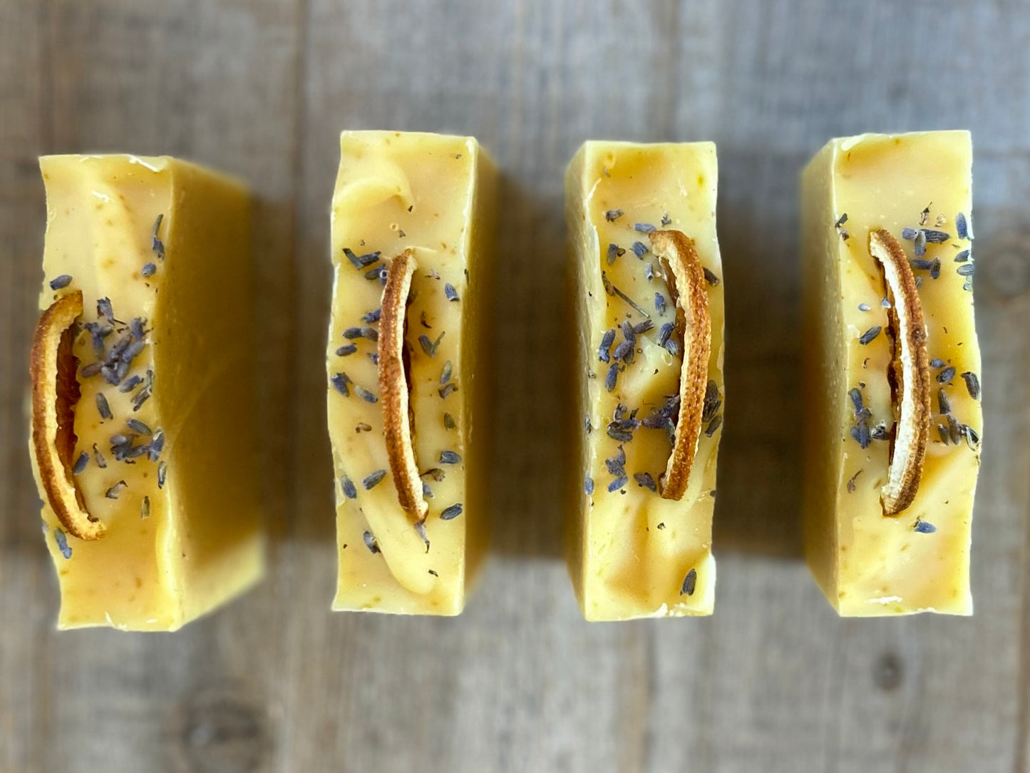 Jump start your morning routine with the invigorating smell of Orange Lavender soap. Made with nourishing goat's milk, cocoa butter, shea butter, avocado oil, kaolin clay and orange peel to lightly exfoliate, refresh and soften the skin.  Kendrick Homestead