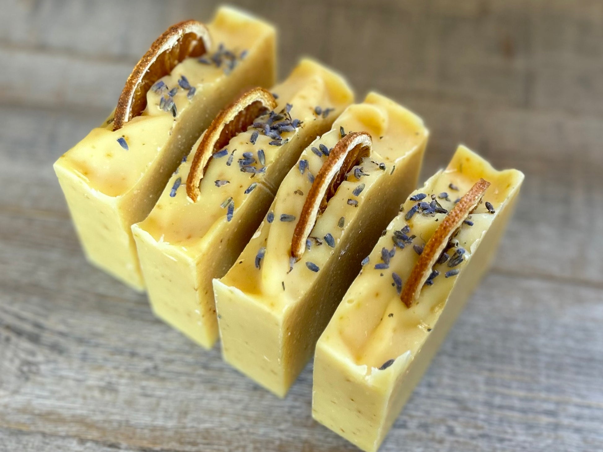 Jump start your morning routine with the invigorating smell of Orange Lavender soap. Made with nourishing goat's milk, cocoa butter, shea butter, avocado oil, kaolin clay and orange peel to lightly exfoliate, refresh and soften the skin.  Kendrick Homestead