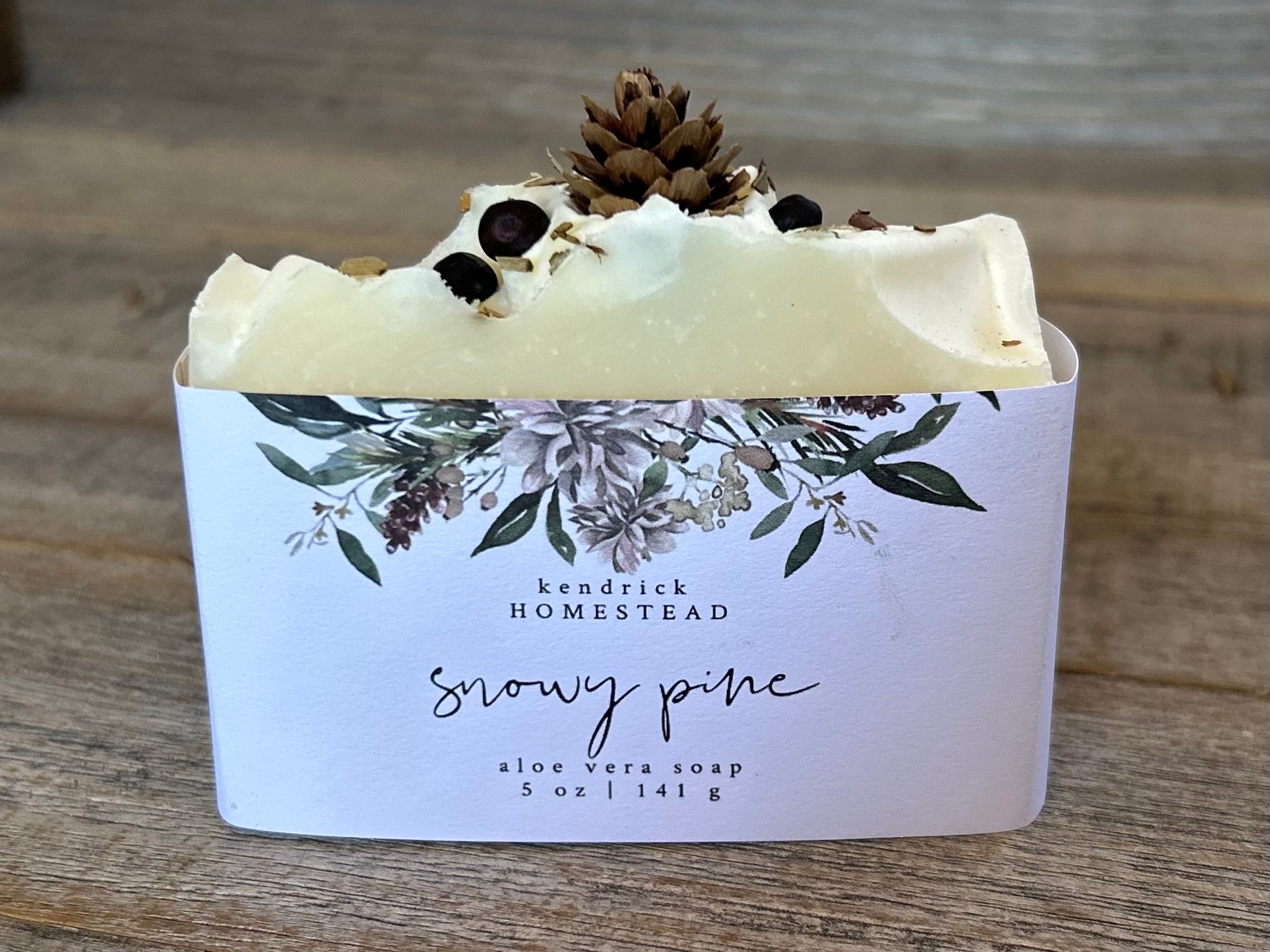 Made with a blend of peppermint, lavender and juniper berry essential oil to promote a sense of balance and calm. Snowy Pine soap is made with soothing aloe vera juice, olive oil, coconut oil, cocoa butter, caster oil and avocado oil. Beautifully decorated to look like a snowy winter, this blend gently cleanses the skin while relieving tension and easing the mind.  Kendrick Homestead