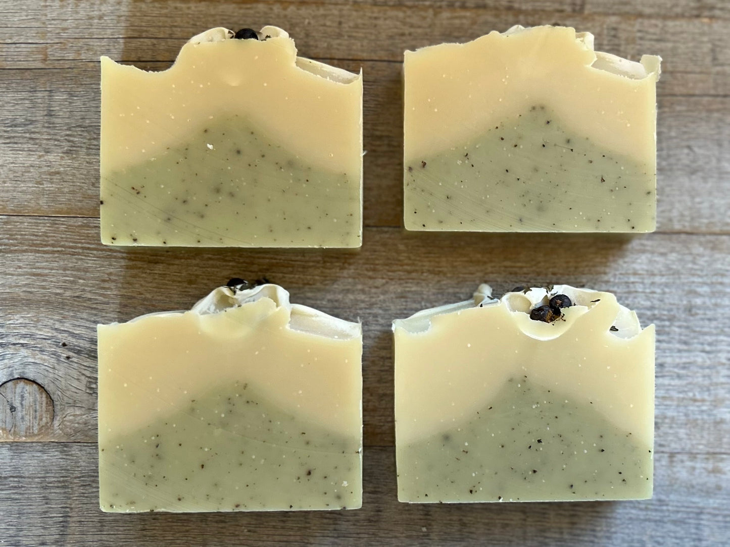 Into The Woods soap is made with a blend of peppermint, spearmint and rosemary essential oil for a refreshing, cooling effect on the skin. This blend will ease your mind and clear your senses. Made with nourishing goat's milk, cocoa butter, avocado oil, kaolin clay, french green clay and ground juniper berries for light exfoliation. Kendrick Homestead