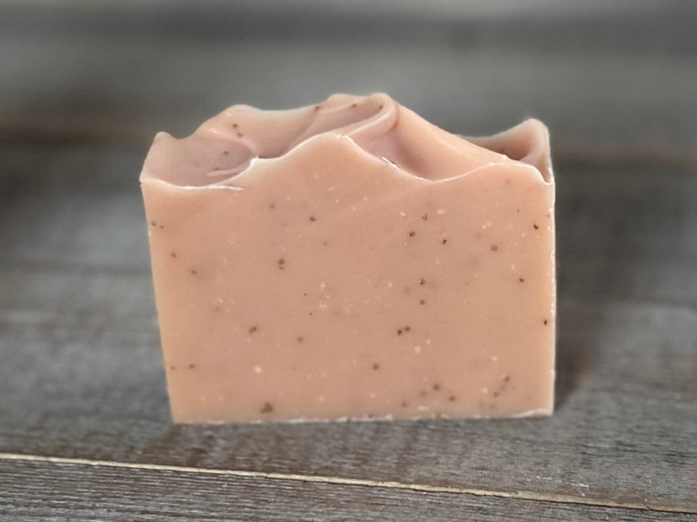 Strawberry Blossom Soap is a sweet citrus blend of neroli and bergamot essential oils. This soap is made with soothing coconut milk, olive oil, coconut oil, cocoa butter, avocado oil and castor oil.&nbsp; Naturally colored with pink clay and strawberry seeds for exfoliation.