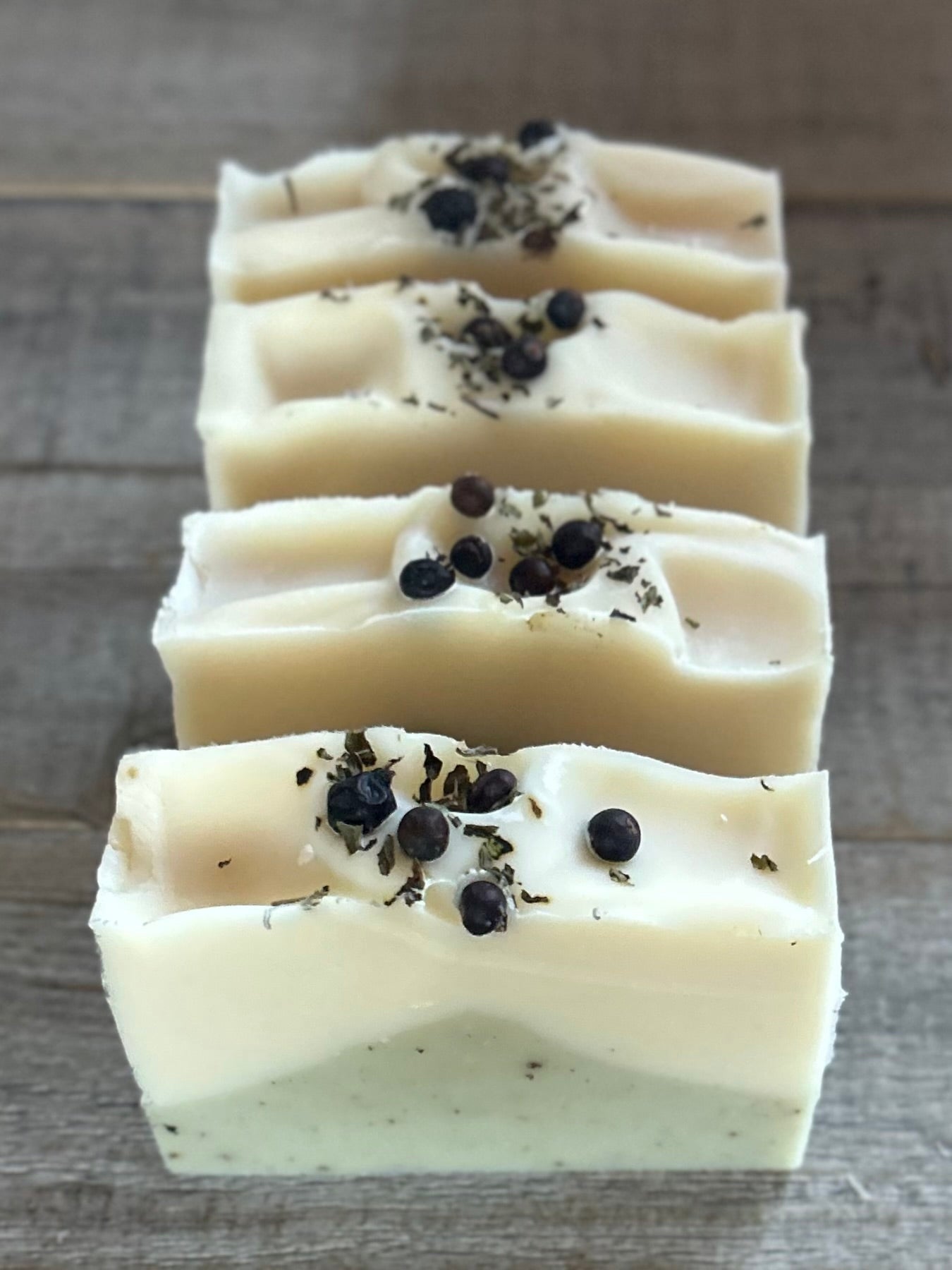 Into The Woods soap is made with a blend of peppermint, spearmint and rosemary essential oil for a refreshing, cooling effect on the skin. This blend will ease your mind and clear your senses. Made with nourishing goat's milk, cocoa butter, avocado oil, kaolin clay, french green clay and ground juniper berries for light exfoliation. Kendrick Homestead