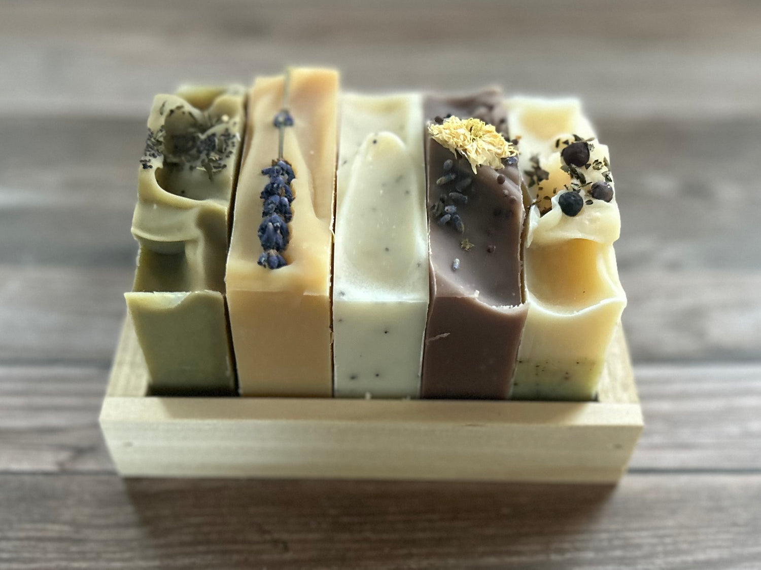 5 soaps in a wood crate