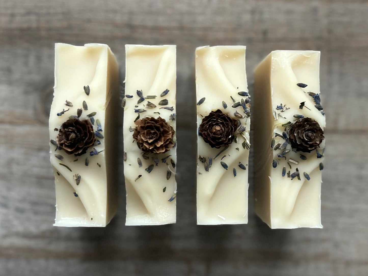 Made with a blend of lavender, peppermint, rosemary and pine needles essential oil to promote a sense of balance and calm. Lavender Pine soap is made with soothing coconut milk, cocoa butter, shea butter, sweet almond oil and caster oil.&nbsp; Beautifully decorated to look like a snowy winter, this blend gently cleanses the skin while relieving tension and easing the mind.

Kendrick Homestead