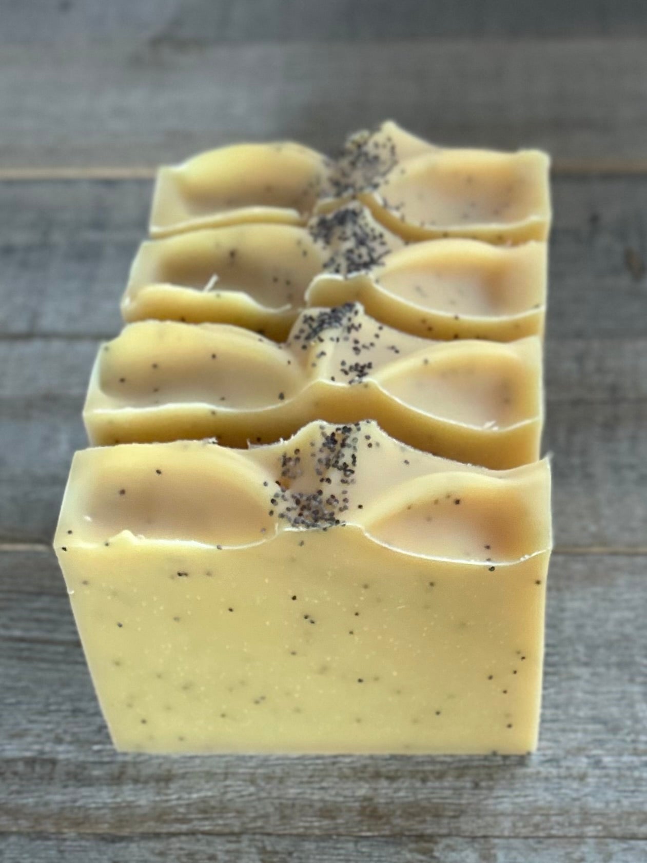 Lemon Poppyseed soap. This is one of my best sellers! Perfect for in your kitchen or take the most refreshing morning shower with this soap! Lemon Poppy Seed soap is made with nourishing goat's milk, olive oil, cocoa butter, shea butter, sweet almond oil and castor oil. It has the vibrant smell of lemon and lemongrass essential oil. Yellow brazilian clay and poppy seeds are added for light exfoliation.  Kendrick Homestead