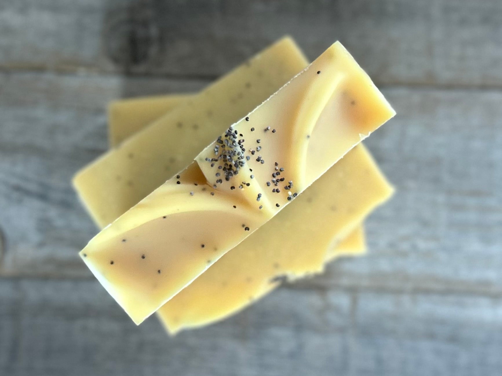 Lemon Poppyseed soap. This is one of my best sellers! Perfect for in your kitchen or take the most refreshing morning shower with this soap! Lemon Poppy Seed soap is made with nourishing goat's milk, olive oil, cocoa butter, shea butter, sweet almond oil and castor oil. It has the vibrant smell of lemon and lemongrass essential oil. Yellow brazilian clay and poppy seeds are added for light exfoliation.  Kendrick Homestead