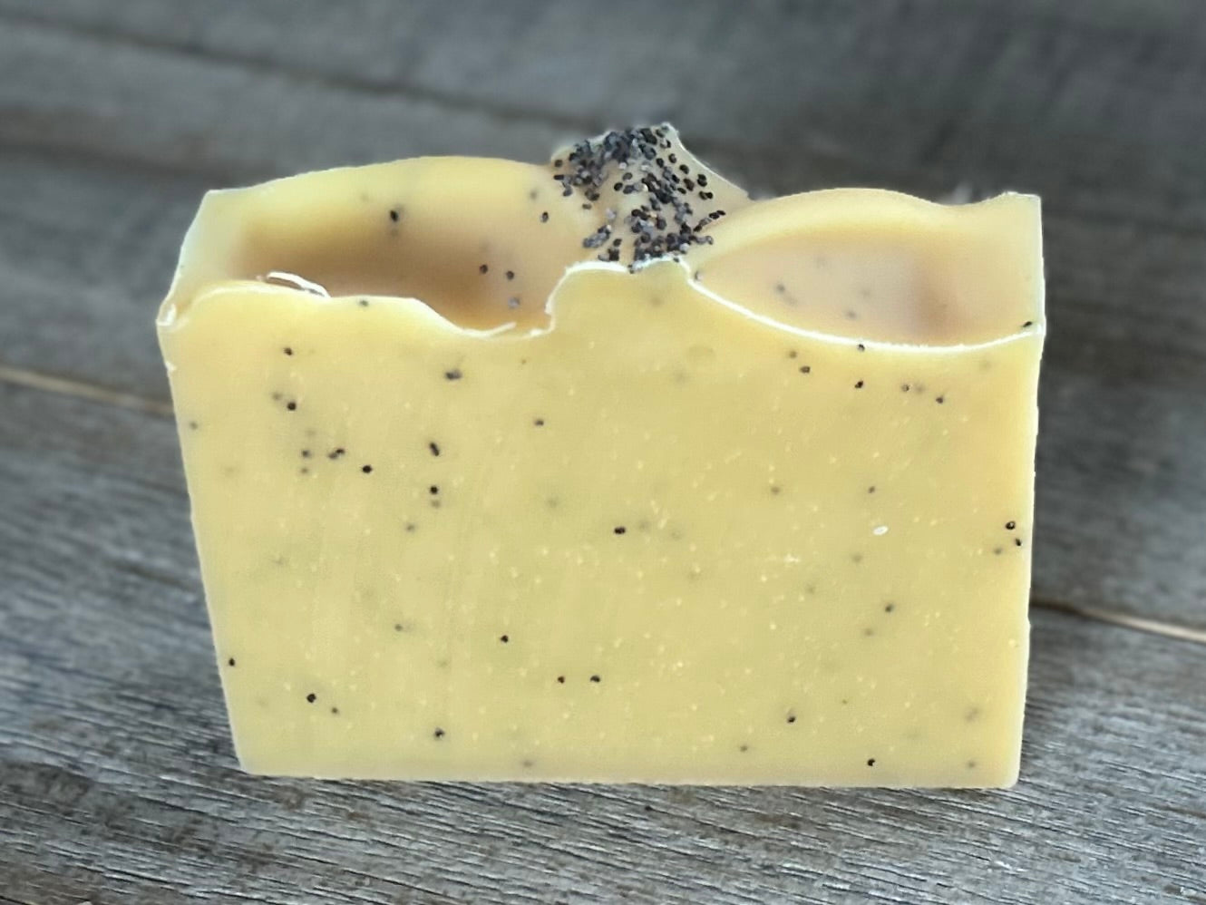 Lemon Poppyseed soap. This is one of my best sellers! Perfect for in your kitchen or take the most refreshing morning shower with this soap! Lemon Poppy Seed soap is made with nourishing goat's milk, olive oil, cocoa butter, shea butter, sweet almond oil and castor oil. It has the vibrant smell of lemon and lemongrass essential oil. Yellow brazilian clay and poppy seeds are added for light exfoliation.  Kendrick Homestead