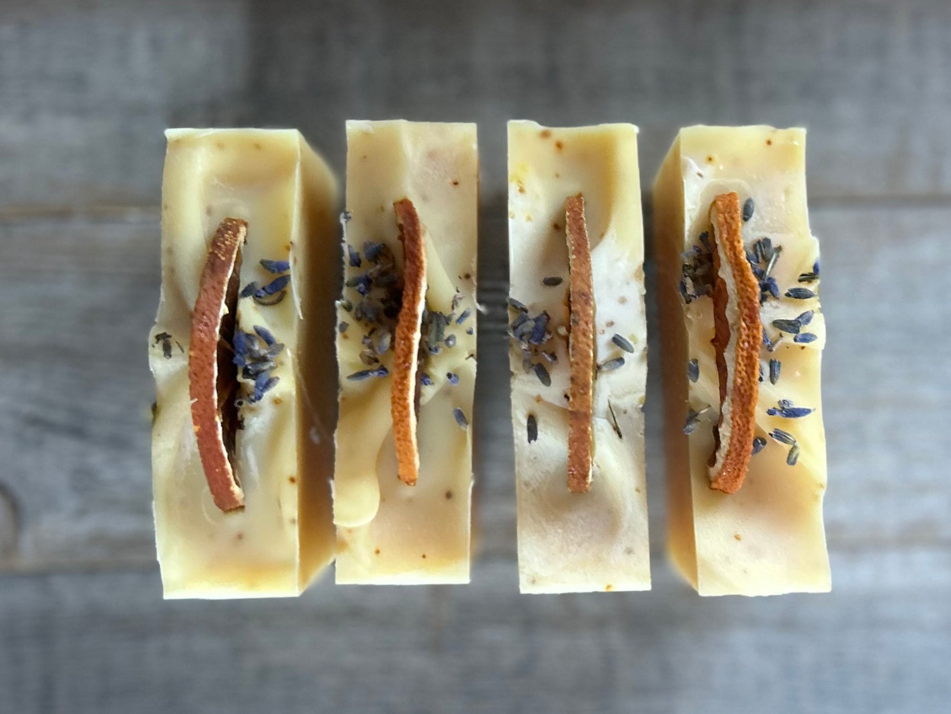 Jump start your morning routine with the invigorating smell of Orange Lavender soap. Made with nourishing goat's milk, cocoa butter, shea butter, avocado oil, kaolin clay and orange peel to lightly exfoliate, refresh and soften the skin.  Kendrick Homestead