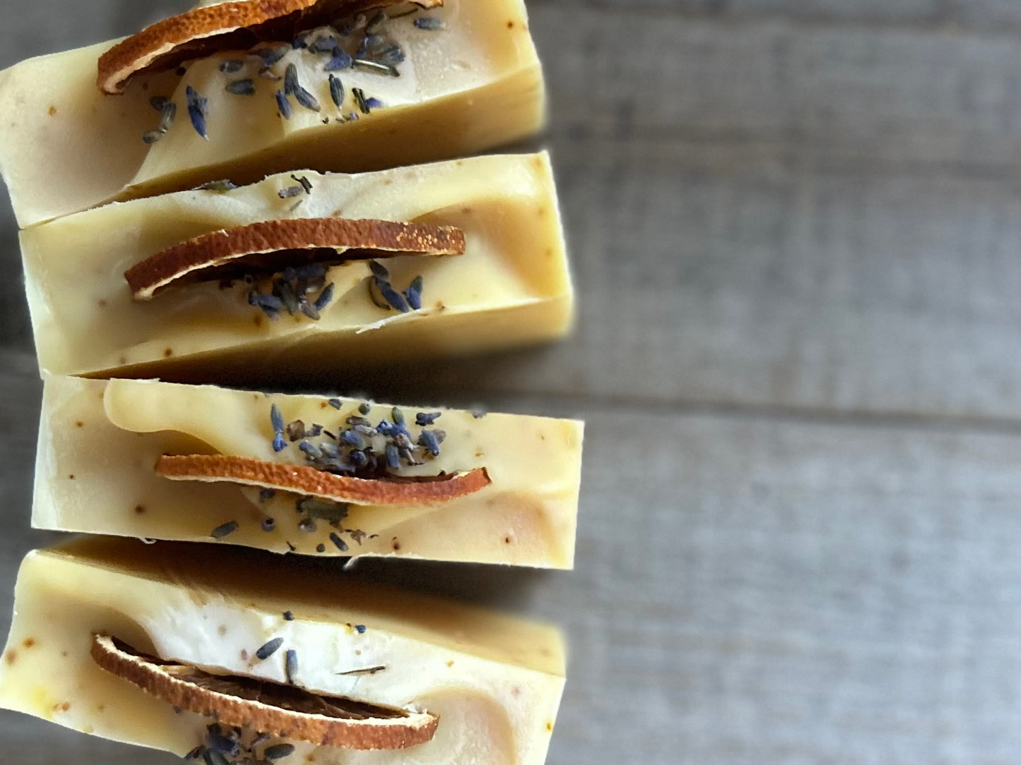 Jump start your morning routine with the invigorating smell of Orange Lavender soap. Made with nourishing goat's milk, cocoa butter, shea butter, avocado oil, kaolin clay and orange peel to lightly exfoliate, refresh and soften the skin.  Kendrick Homestead