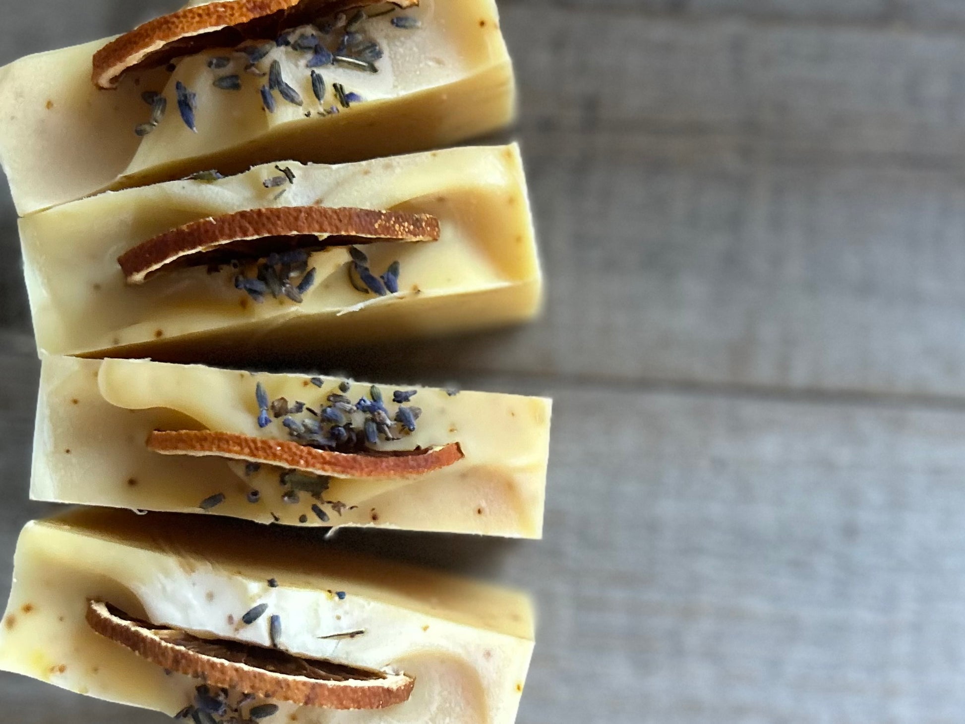 Jump start your morning routine with the invigorating smell of Orange Lavender soap. Made with nourishing goat's milk, cocoa butter, shea butter, avocado oil, kaolin clay and orange peel to lightly exfoliate, refresh and soften the skin.  Kendrick Homestead